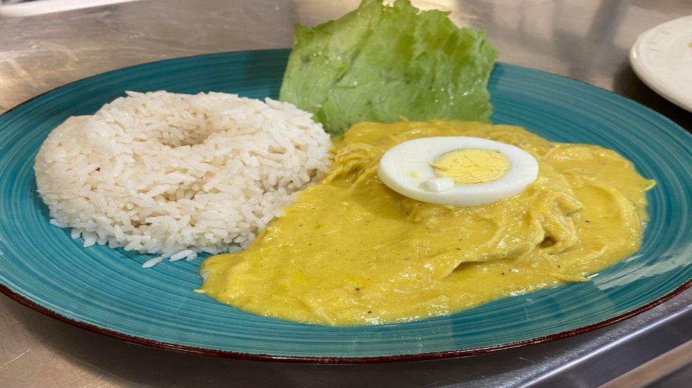 Aji De Gallina · A combination of shredded chicken cooked with our aji amarillo. Served with white rice, olive, and egg. This is a true classic culinary dish.