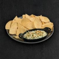 Spinach & Artichoke Dip · Spinach, artichokes, Romano, sauteed onions & red bell peppers Topped with Parmesan bread cr...