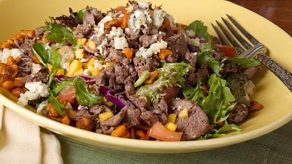 Z’Chopped Salad · romaine, black beans, jalapeño bacon, corn relish, avocado, pico gallo, mixed cheese, choice of dressing, with protein.  Steak, tuna and salmon are cooked to order. Consuming raw or  undercooked meats, poultry, seafood, shellfish or eggs may increase may increase your risk of foodborne