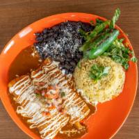 Santa Fe Enchiladas · mixed cheese, corn tortillas, choice of smoked chicken with red sauce, or barbacoa beef with...