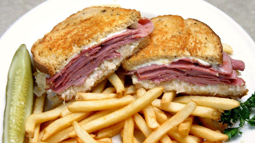 Yankee Reuben Sandwich · Thinly sliced corn beef piled high with swiss cheese, sauerkraut, and thousand island dressing, grilled to perfection.