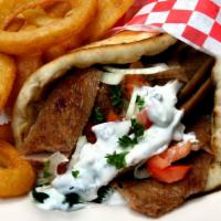Gyro Sandwich · Combination of savory lamb and beef freshly ground and sliced topped with tomatoes. Served w...