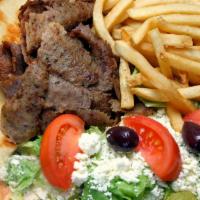 Gyro Dinner · A greek classic a combination of savory lamb and beef freshly ground and sliced. Served with...