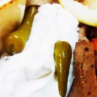 Gyro Sandwich · Lamb and beef gyro meat wrapped in pita bread with onions, tomatoes, tzatziki, sport peppers...