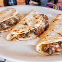 Quesadilla · Regular corn or flour tortilla, served with melted mozzarella cheese and your choice of meat.