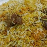 Mutton Biryani · Marinated lamb meat cooked with rice and spices. Served with yoghurt dip and spicy sauce.