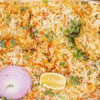 Chicken Biryani · Marinated chicken cooked with rice and spices. Served with yoghurt dip and spicy sauce.
