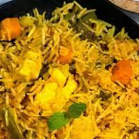 Vegetable Biryani · Vegetables cooked with rice with spices. Served with yoghurt dip and spicy sauce.