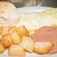 Mexican Omelette · Three egg omelet made with green peppers, onions, tomatoes, and cheese served with beans and...