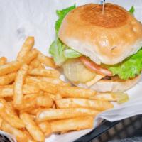 Henry'S Burger · Served with french fries dressed with lettuce, tomatoes, onions, pickles, mayonnaise and mus...