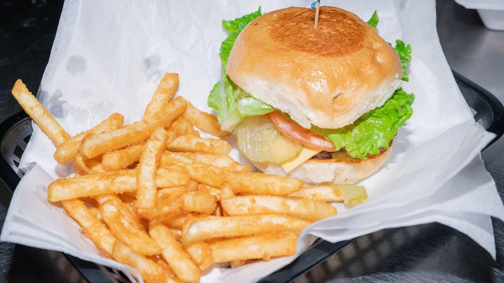 Henry'S Burger · Served with french fries dressed with lettuce, tomatoes, onions, pickles, mayonnaise and mustard.