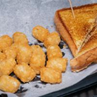 Grilled Cheese · Simple and delicious with two slices of American on thick Texas toast served with French fri...