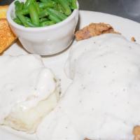 Henry'S Hand Cut Chicken Fried Steak · Hand battered chicken fried steak, served with two sides and Texas toast.