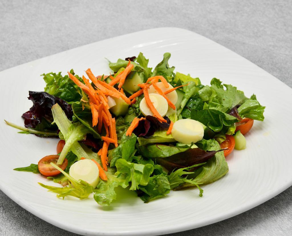 The Palm Mixed Green Salad · Romaine, iceberg, baby greens, radish, scallions, cherry tomatoes, carrots, tossed in garlic vinaigrette.