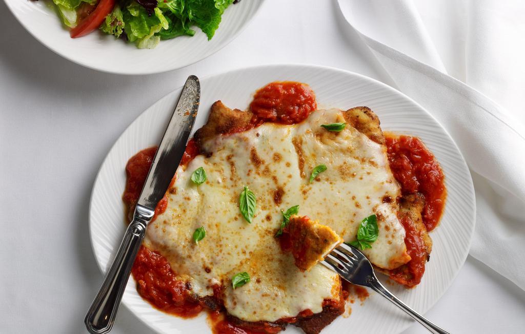 Chicken Parmigiana · Classic Chicken Parmesan topped with marinara sauce, Parmesan and Muenster cheese and finished in the broiler.