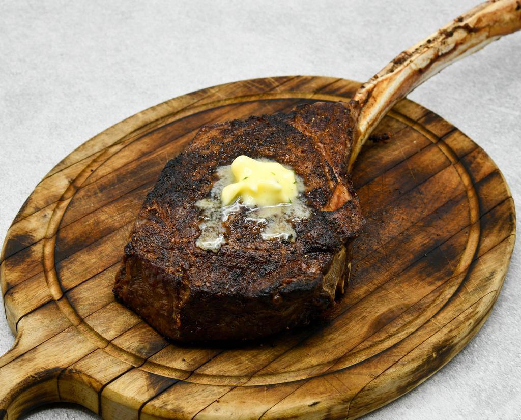Prime Tomahawk Ribeye* 32 Oz · The palm proudly serves aged USDA prime beef, corn-fed, hand selected and aged a minimum of 35 days.
