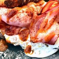 Egg & Bacon · Three strips of smoked bacon mixed with three eggs.