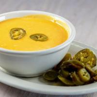 Chile Con Queso · Served with chips.