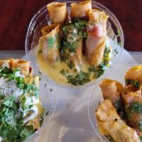 Triple Dipper · Sample our House Queso, Queso Blanco and our salsa with Home-Made Potato Chips.