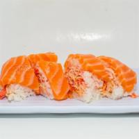 Pink Sweet Roll (8Pcs) · crabstick & masago mixed w/martini sauce / salmon, wrapped in soypaper, wasabi sauce