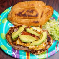 Torta Cubana · Choice of meat along with ham, sausage (hot dog franks) and fried egg (well done). Torta inc...