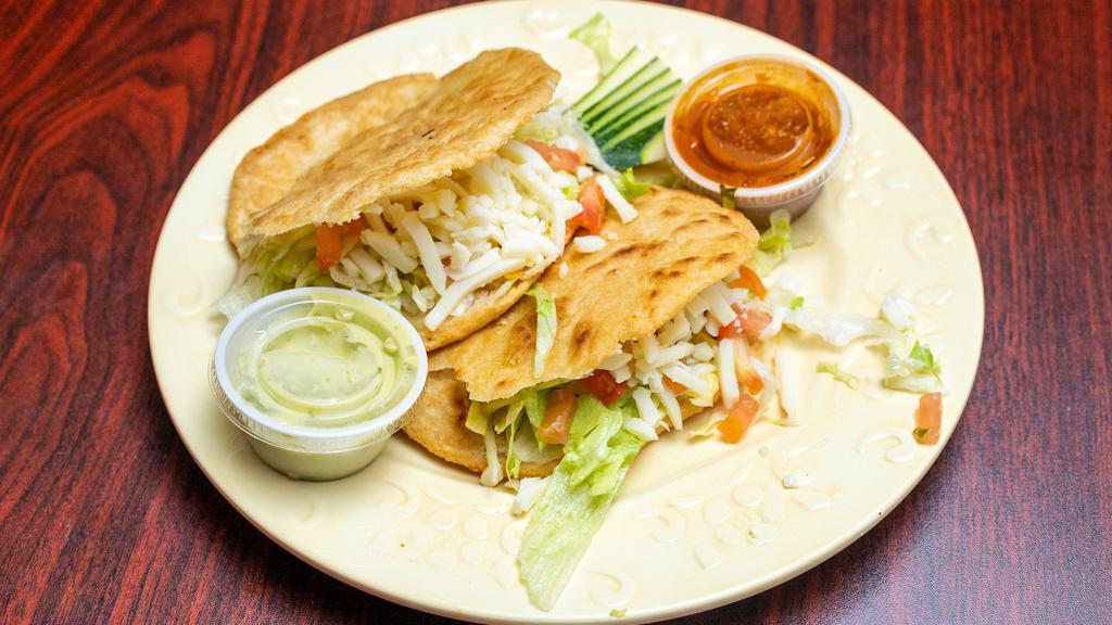 Gorditas · Choice of meat topped with cheese, lettuce, tomatoes and sour cream