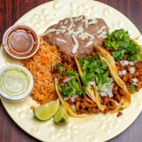 Tacos Al Carbon Combo With Coke Product (12 Oz) · 3 - Tacos with choice of one meat topped with diced onions and cilantro. This combo includes...