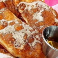 Bunuelos · Deep fried flour topped with cane sugar & cinnamon - drizzled with agave