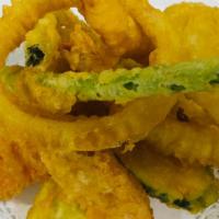 Shrimp & Vegetable Tempura · Se style battered two pieces shrimp and vegetable tempura served with tempura.