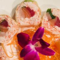 Sexy Ladies · Crabmeat, tuna, salmon, yellowtail, spring mix veggie's, wrapped with pink soy paper served ...