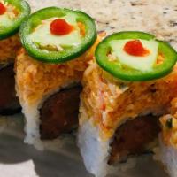 Panic · Spicy tuna roll topped wth spicy crab, jalapeño and sriracha.