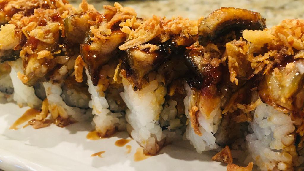 Dark Samurai · Shrimp tempura, spicy crab roll topped with unagi, avocado, spicy mayo, eel sauce, and sriracha.