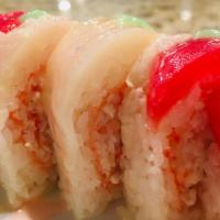 Candy Cane · Fresh salmon, crabmeat, and avocado wrapped in soy paper, topped with super white tuna, blue...