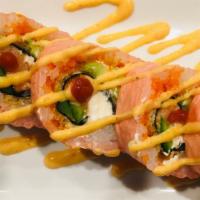 Tiger Eye · Smoked salmon, cream cheese, and jalapeno wrapped in seaweed, deep fried, then wrapped with ...