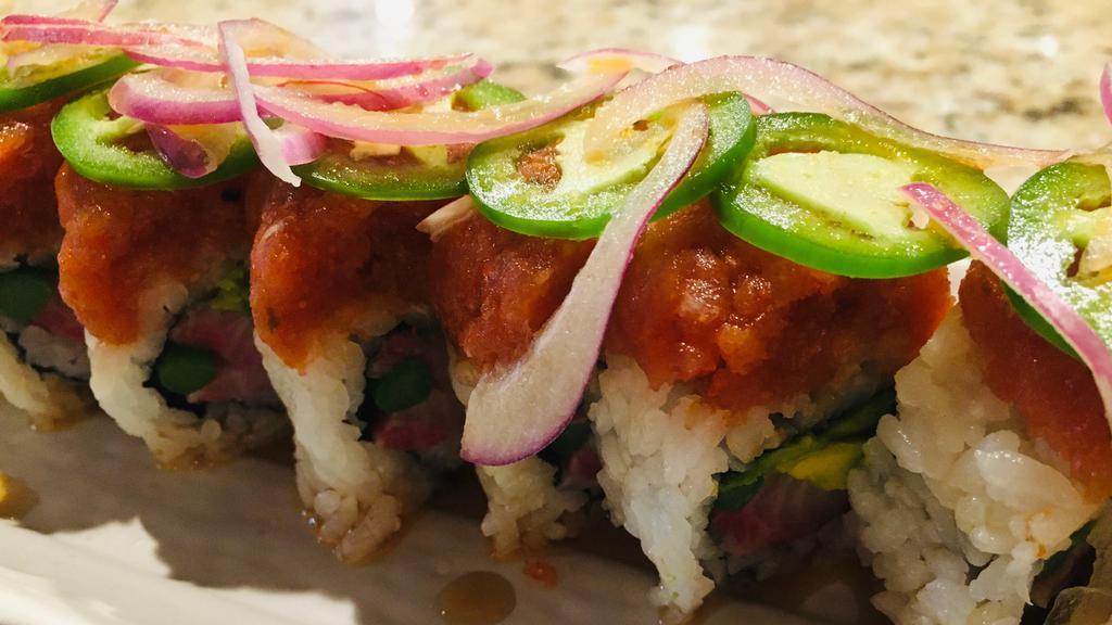 Yellowtail Special · Yellowtail, cucumber, avocado, and asparagus, topped with spicy tuna, red onion, jalapeno, and ponzu sauce.