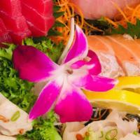 Sashimi Combination · Chef's choice of 12 pieces sashimi served with miso or clear soup and salad.