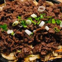 Bulgogi · Thinly sliced beef ribeye marinated in the traditional Korean style, onion and cabbage mix s...