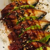 Unadon · A bowl of steamed rice topped with 6pcs of grilled unagi (eel) fillets are glazed with sweet...