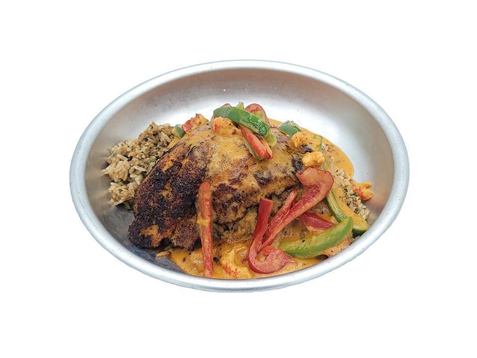 Catfish Atchafalaya · Blackened Catfish smothered in a crawfish cream sauce on a bed of Dirty Rice