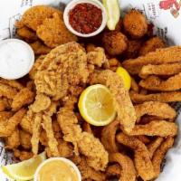 Big Eazy · Have it all! Catfish, shrimp, calamari and soft shelled crab, all golden fried with hush pup...