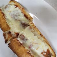 Sausage Parmigiana · Sliced Italian sausage smothered in marinara sauce and covered with mozzarella cheese on an ...