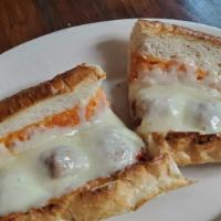 Chicken Parmigiana · Breaded chicken breast smothered in marinara sauce and covered with mozzarella cheese on an ...