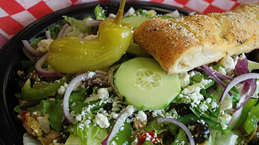 Greek · Romaine lettuce, bell pepper, red onion, cucumber, feta cheese, Papa's Greek signature dressing, and olive salad mix.