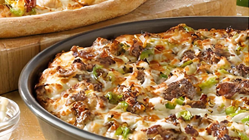 Philly Cheesesteak · Chicken or Beef, mushrooms, mozzarella, bell peppers, onions, and garlic butter.
