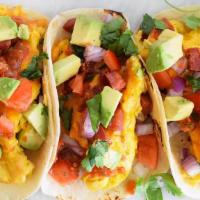 Breakfast Tacos (3) · Bacon, egg and cheese or potato, egg and cheese breakfast tacos, served with sofrito black b...