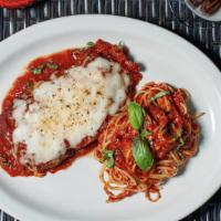 Chicken Parmigiana · Breaded chicken topped with marinara, mozzarella, over spaghetti.