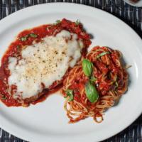 Veal Parmigiana · Breaded veal topped with marinara, mozzarella, over spaghetti.