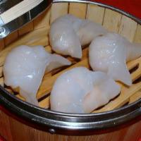 Har Gao (6) · Traditional Chinese dim sum. Shrimp dumplings steamed in a bamboo cage.