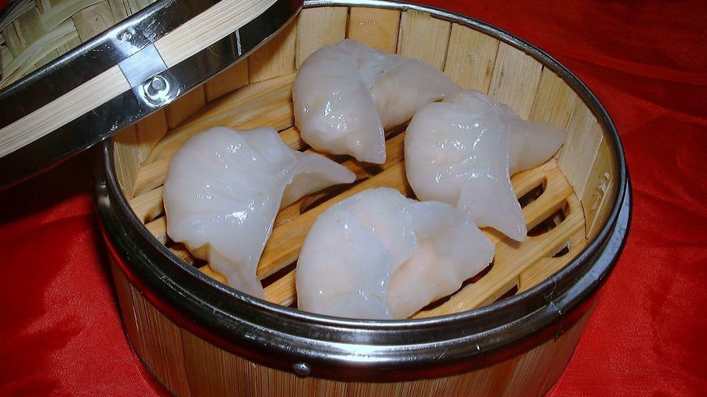 Har Gao (6) · Traditional Chinese dim sum. Shrimp dumplings steamed in a bamboo cage.