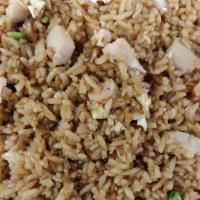  Fried Rice With Chicken · Fried rice stirred- fried with chicken egg and small pieces of peas carrots onion.